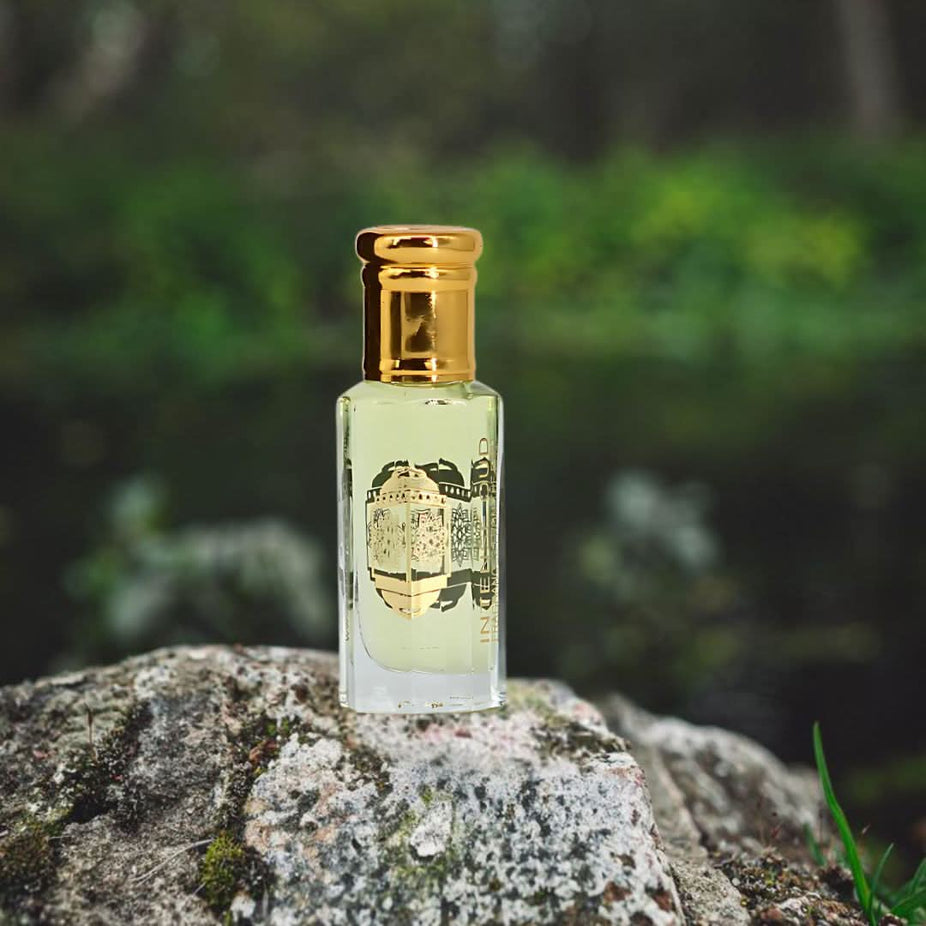 Amber Rose perfume oil by Intense Oud in a 12ml loose oil bottle, displayed with a black gift box.