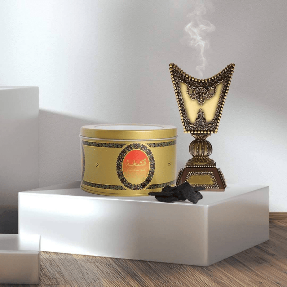 Swiss Arabian Kashkha Oud Muattar Bakhoor 24 GM jar with fragrant oud incense sticks and traditional packaging.