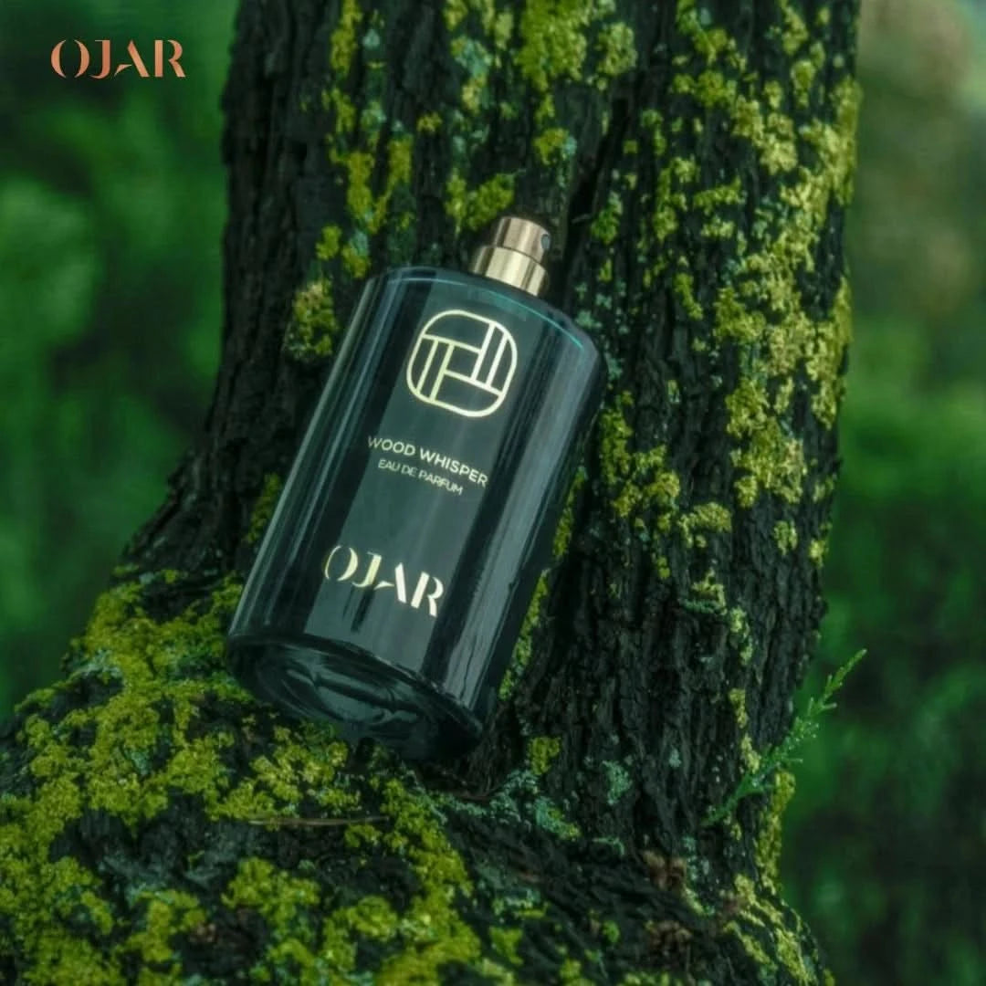 Ojar Wood Whisper Eau De Parfum 100ml bottle, elegant glass container with floral and woody scent notes.