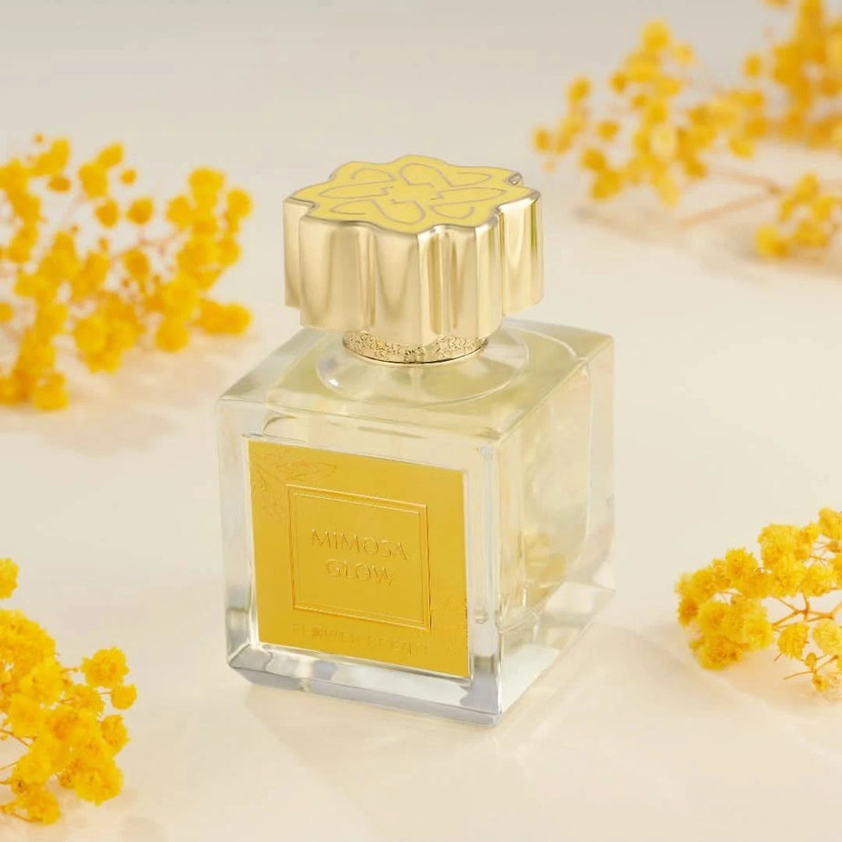 Flower Scents Mimosa Glow Eau de Parfum spray 65ml bottle with elegant packaging, showcasing the floral fragrance design.