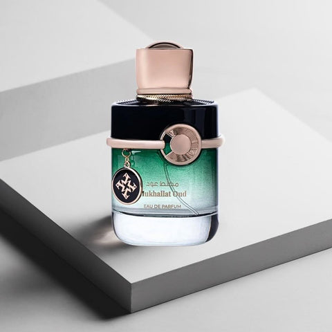 Azha Oud Collection Mukhallat Oud EDP 100ML perfume bottle with elegant packaging and luxurious golden accents.