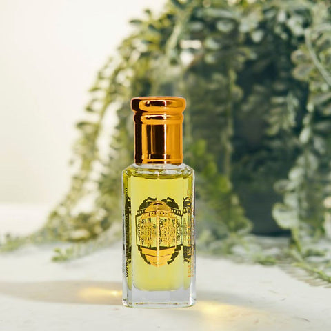 Intense Oud Scandalous Perfume Oil 12ml in a black gift box, featuring a sleek glass bottle with a dropper for easy application.