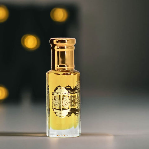 Bengal Oud Perfume Oil 12ml in a black gift box by Intense Oud, featuring transparent bottle with amber-colored oil inside