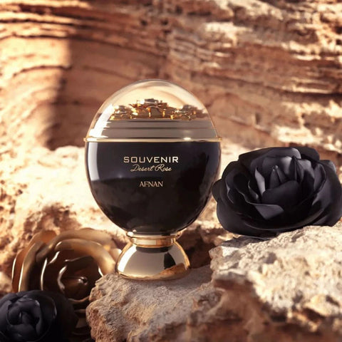 Afnan Souvenir Desert Rose Eau de Parfum spray 100ml with a velvet pouch, featuring a sleek glass bottle and floral design.