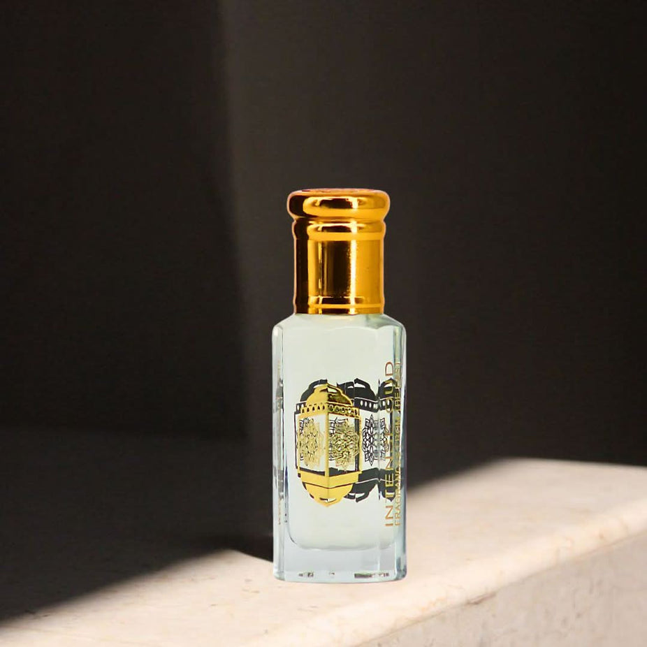Intense Oud Al Bahar perfume oil in a 12ml bottle, displayed with a sleek black gift box, highlighting the luxurious loose oil packaging.
