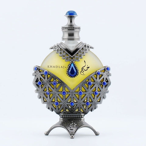 Khadlaj Hareem Al Sultan Blue antique perfume oil in a 35ml bottle with a velvet pouch, showcasing elegant packaging.