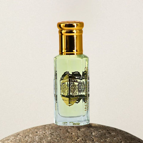 Intense Oud Majnoon Perfume Oil 12ml in a black gift box, featuring a luxurious loose oil container with elegant branding.