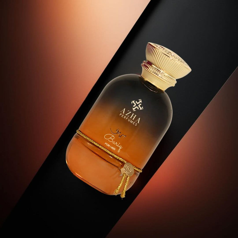 Bariq for Her Eau de Parfum spray by AZHA, 100ml bottle with elegant floral design, showcasing the fragrance packaging.