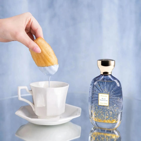 Blue Madeleine Eau de Parfum spray by Atelier Des Ores, featuring a sleek blue glass bottle with elegant design.