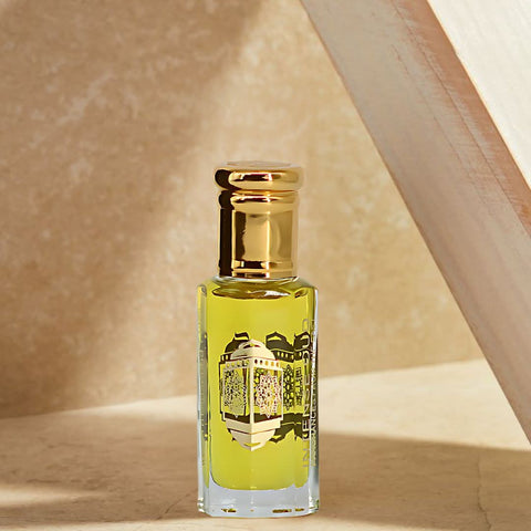 Intense Oud Now Girl perfume oil in 12ml bottle with black gift box, featuring elegant packaging and product branding.