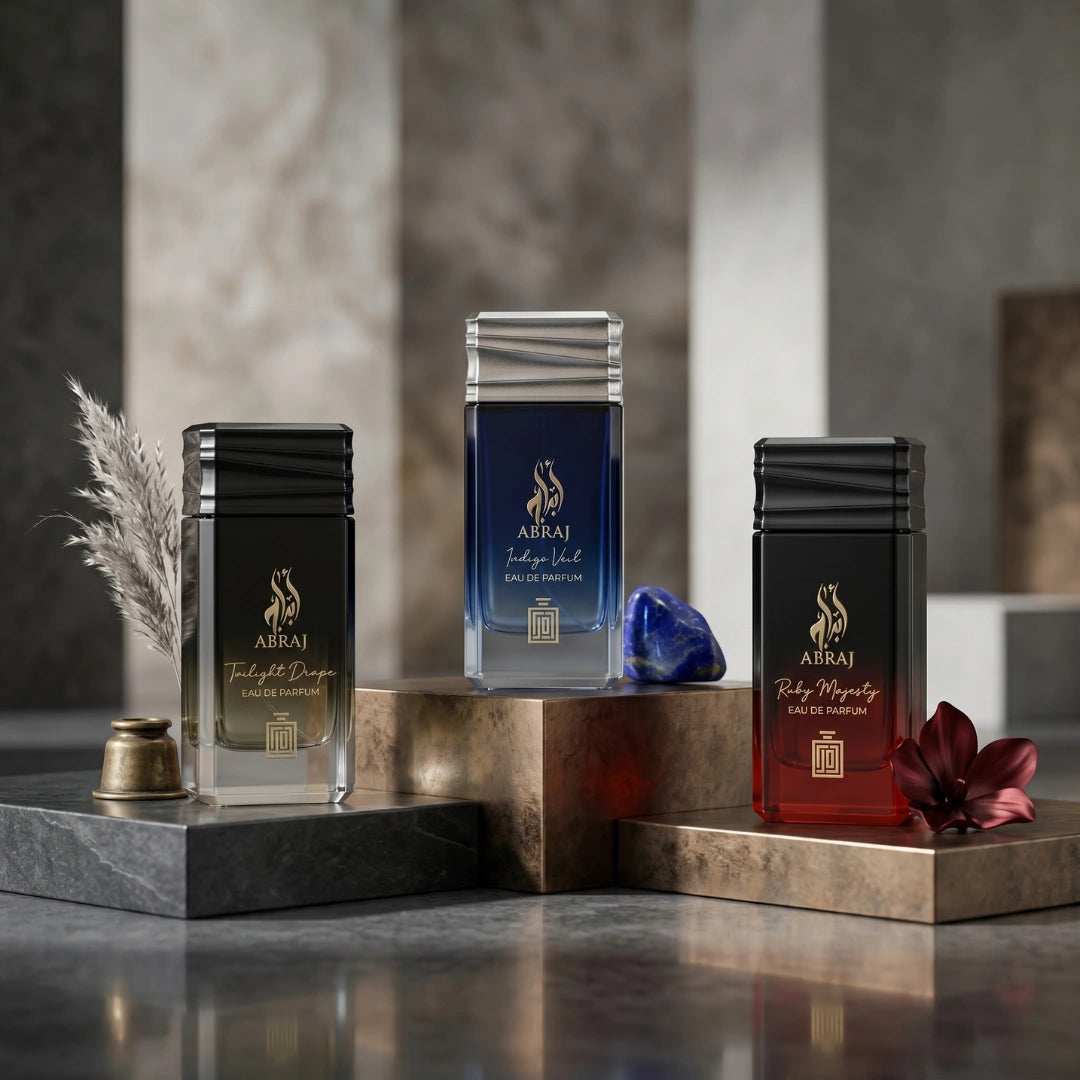 Aura Fragrances Abraj Twilight Drape, Ruby Majesty, and Indigo Veil Eau De Parfum Spray 100ml bundle with elegant perfume bottles.