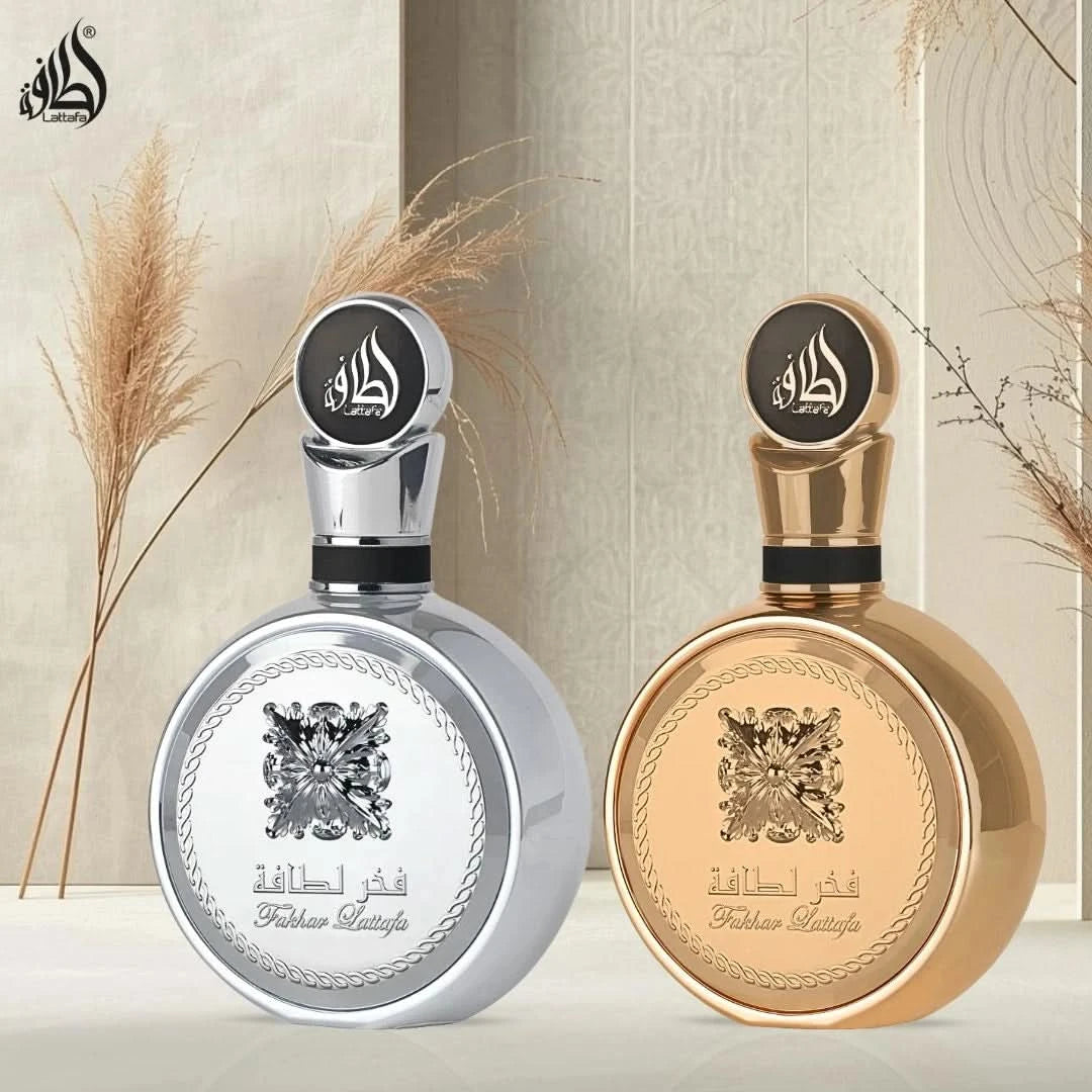 Bundle of Fakhar Platin and Fakhar Gold Extrait Eau de Parfum sprays by Lattafa, 100ml each, with elegant bottle designs.