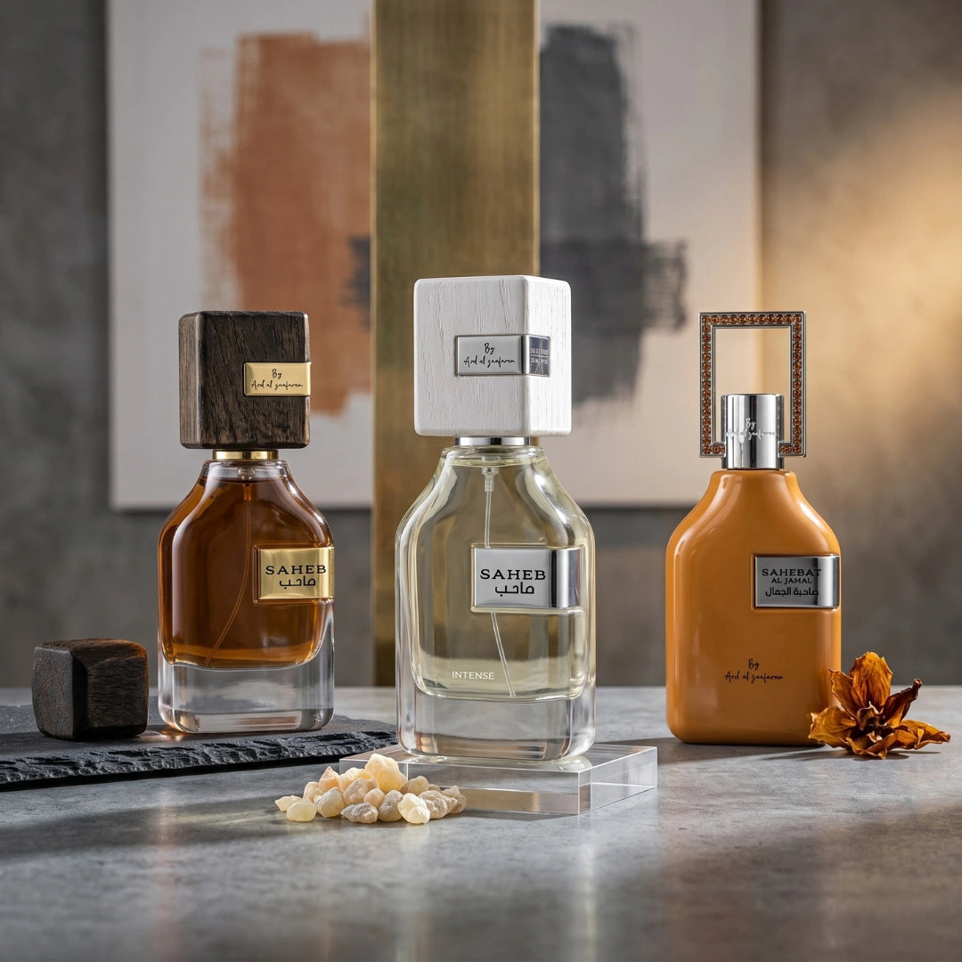 Bundle of Ard Al Zaafaran Saheb, Saheb Intense & Sahebat Al Jamal Eau de Parfum sprays, featuring elegant glass bottles in a decorative display.