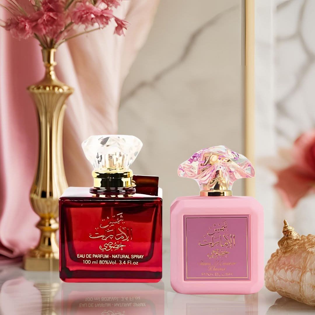 Bundle of Ard Al Zaafaran Shams Al Emarat Khususi and Pink Blush Eau de Parfum sprays, 100ml bottles, with elegant packaging.