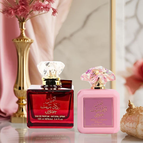 Bundle of Ard Al Zaafaran Shams Al Emarat Khususi and Pink Blush Eau de Parfum sprays, 100ml bottles, with elegant packaging.