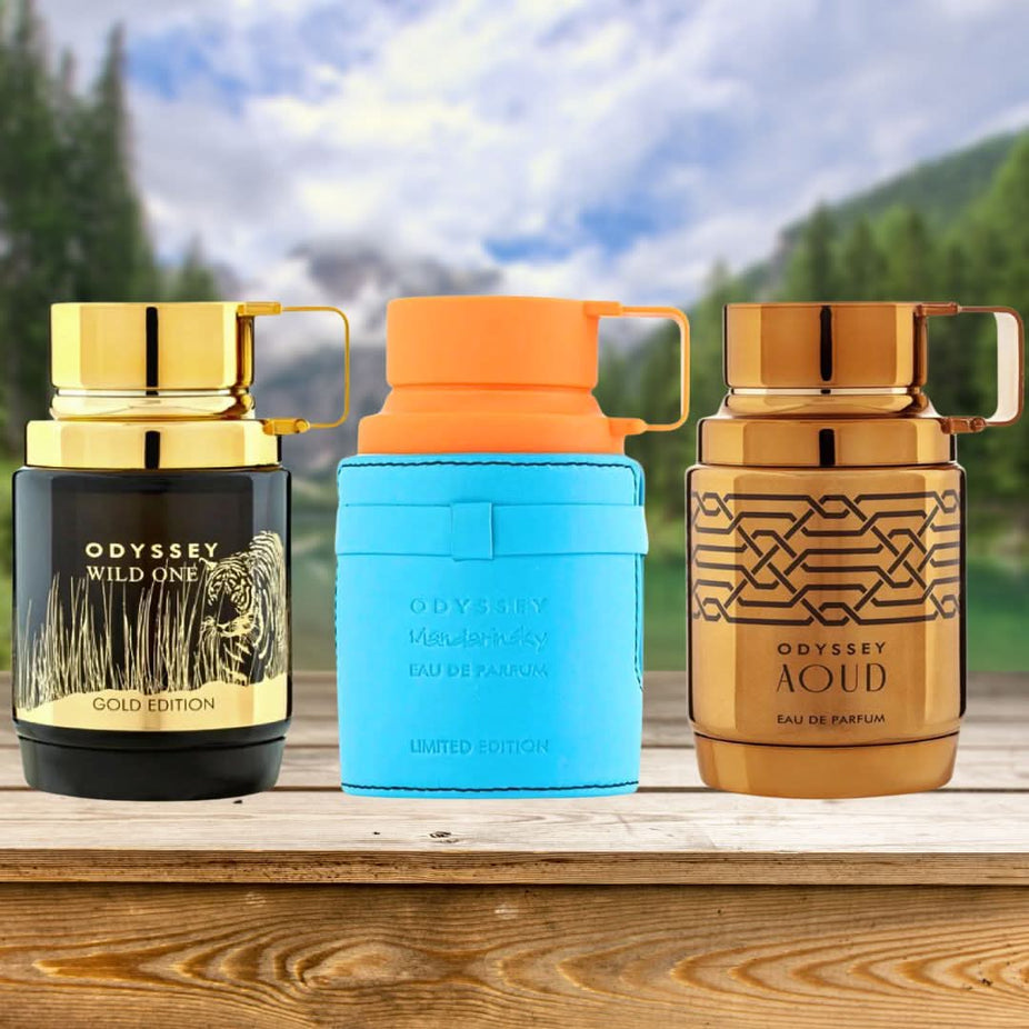 Armaf Odyssey Mandarin Sky, Aoud Edition, and Wild One Gold Eau de Parfum sprays in a collection, 100ml bottles, with elegant packaging.