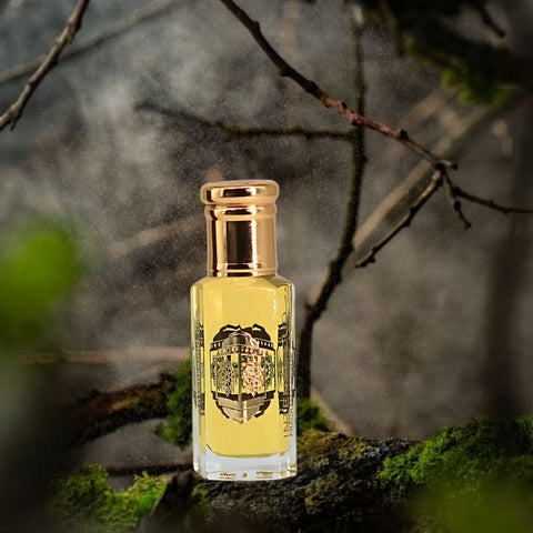 Intense Oud Attar Majmu perfume oil in 12ml bottle with black gift box, featuring a loose oil design and elegant packaging.