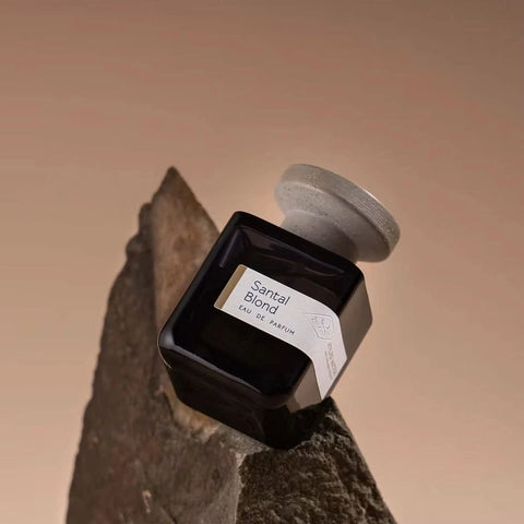 Atelier Materi Santal Blond Eau de Parfum spray bottle, 100ml, with elegant minimalist design and soft beige tones.