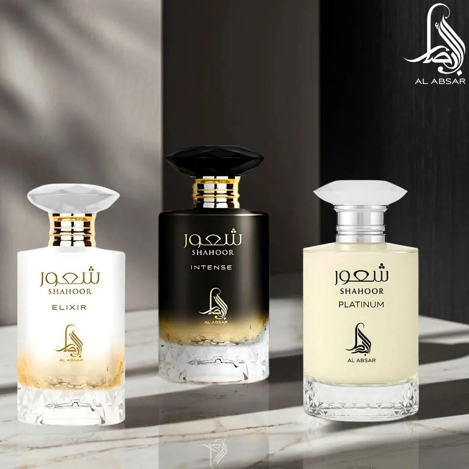 Bundle of Al Absar Shahoor Intense, Elixir, and Platinum Eau de Parfum sprays in 100ml bottles, featuring elegant perfume bottles.