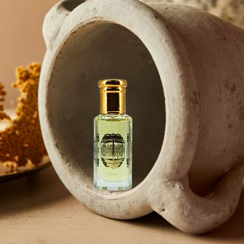 Intense Oud Warda Perfume Oil 12ml in a black gift box, featuring a clear glass bottle with elegant loose oil for fragrance.