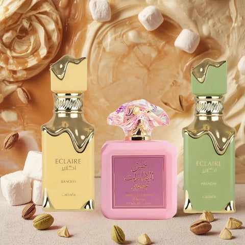 Bundle of Lattafa Eclaire Pistache, Eclaire Banoffi, and Pink Blush Eau de Parfum sprays in 100ml bottles, showcasing colorful perfume bottles.