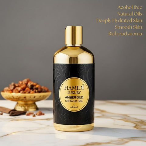 Hamidi Luxury Amber Oud Shower Gel 500ml bottle with amber-colored liquid and elegant packaging, showcasing a premium fragrance product.