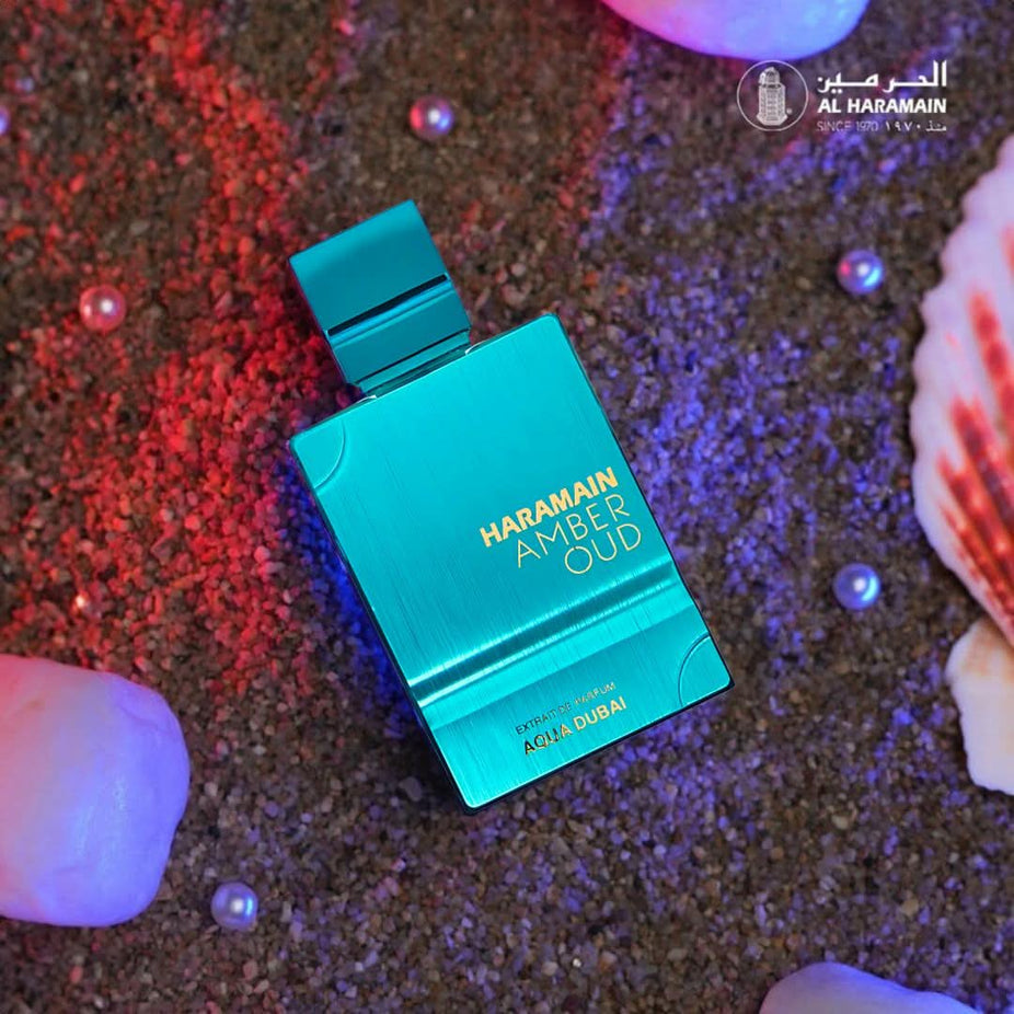 Amber Oud Aqua Dubai Extrait de Parfum spray by Al Haramain, showing the elegant 100ml bottle with a sleek design.