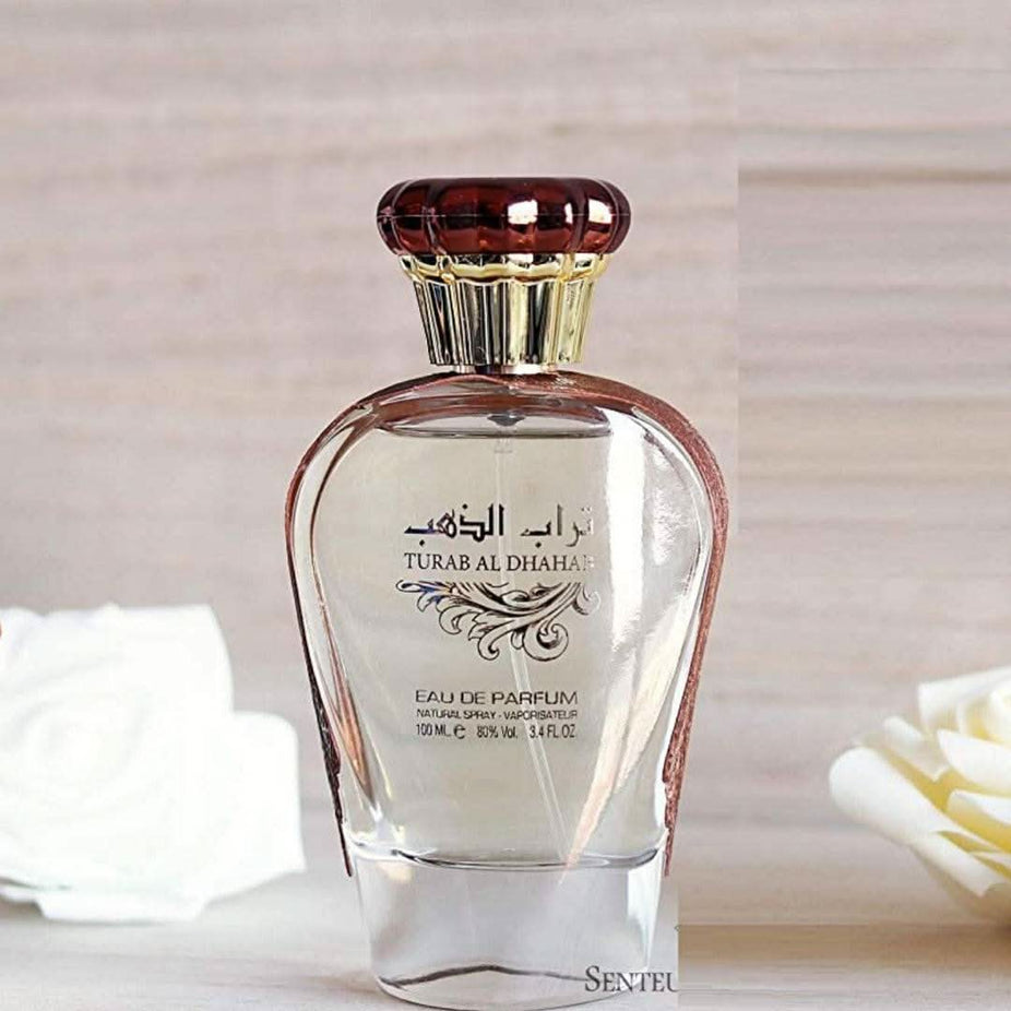 Ard Al Zaafaran Turab Al Dhahab Eau de Parfum spray 100ml with elegant gold and black packaging, showcasing the perfume bottle.