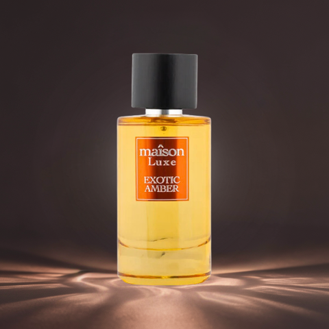 Maison Luxe Exotic Amber Eau de Parfum Spray by Hamidi in a velvet pouch, showcasing the elegant glass bottle and amber fragrance.
