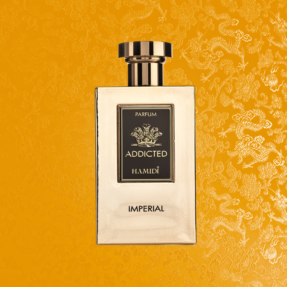 Hamidi Addicted Imperial EDP spray 120ML with ocean breeze fragrance, featuring a sleek bottle and refreshing scent outdoors.