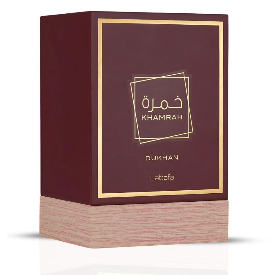 Khamrah Dukhan Eau de Parfum spray by Lattafa, 100ml bottle with elegant design and dark amber liquid.