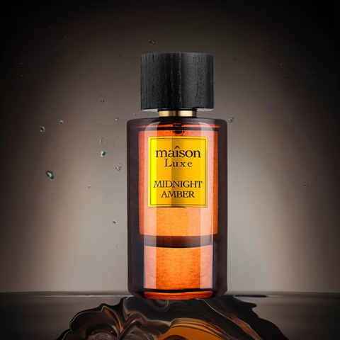 Maison Luxe Midnight Amber Eau de Parfum spray by Hamidi, featuring a sleek bottle and rich amber fragrance.