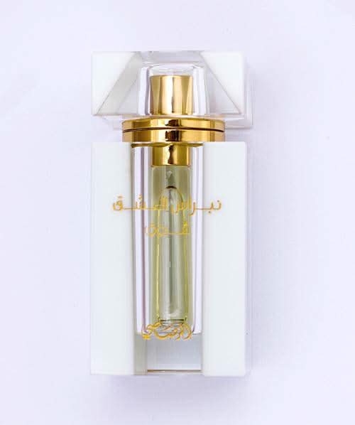 Rasasi Nebras Al Ishq CPO series 3-piece perfume oil set with ornate bottles, showcasing elegant design and luxurious packaging.