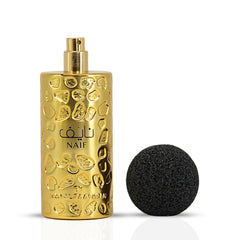 Naif perfume bottle with cap removed - Intense Oud