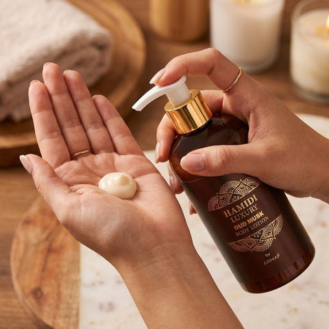 Hamidi Luxury Oud Musk Body Lotion 500ml bottle with elegant packaging and a smooth lotion texture in a clear container.