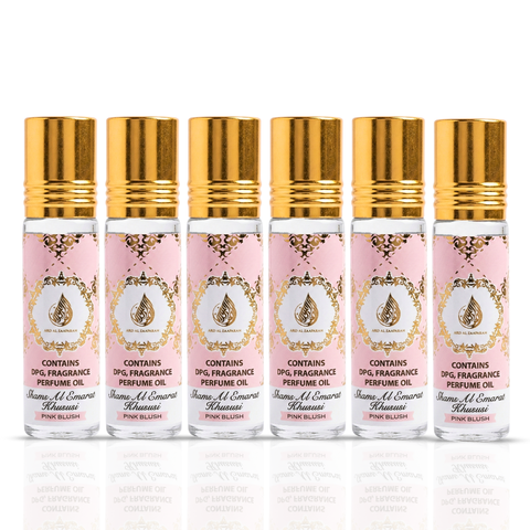 Pack of three Pink Blush Shams Al Emarat Khususi roll-on perfume oils by Ard Al Zaafaran, 10ml each, in a clear display.