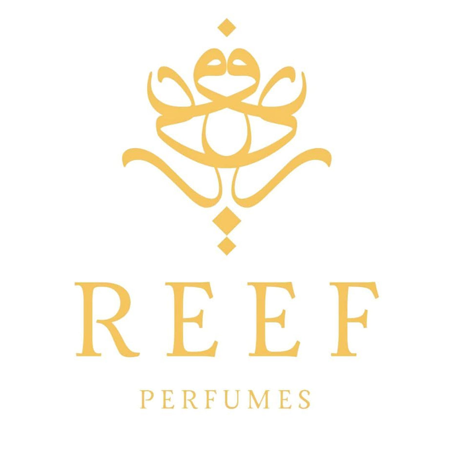 Reef Perfumes Summer Pink EDP 100ML bottle with pink liquid and floral design, showcasing a luxurious, long-lasting fragrance.