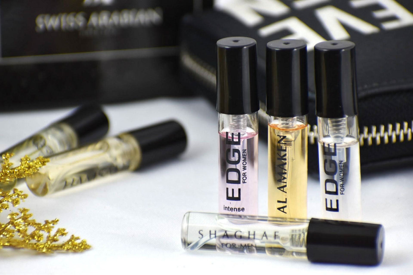 Swiss Arabian sample set including Edge & Intense women’s perfumes, Hamsah, Shaghaf men’s fragrances, and Amaken sample bottles.