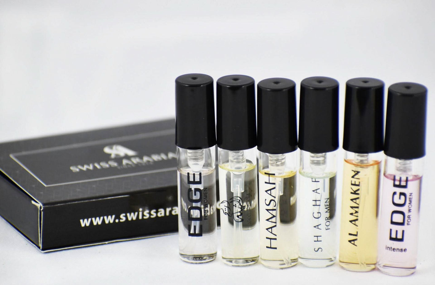 Assorted Swiss Arabian perfume samples for women and men, including Areej Al Sheila, Hamsah, Shaghaf, and Amaken fragrances.