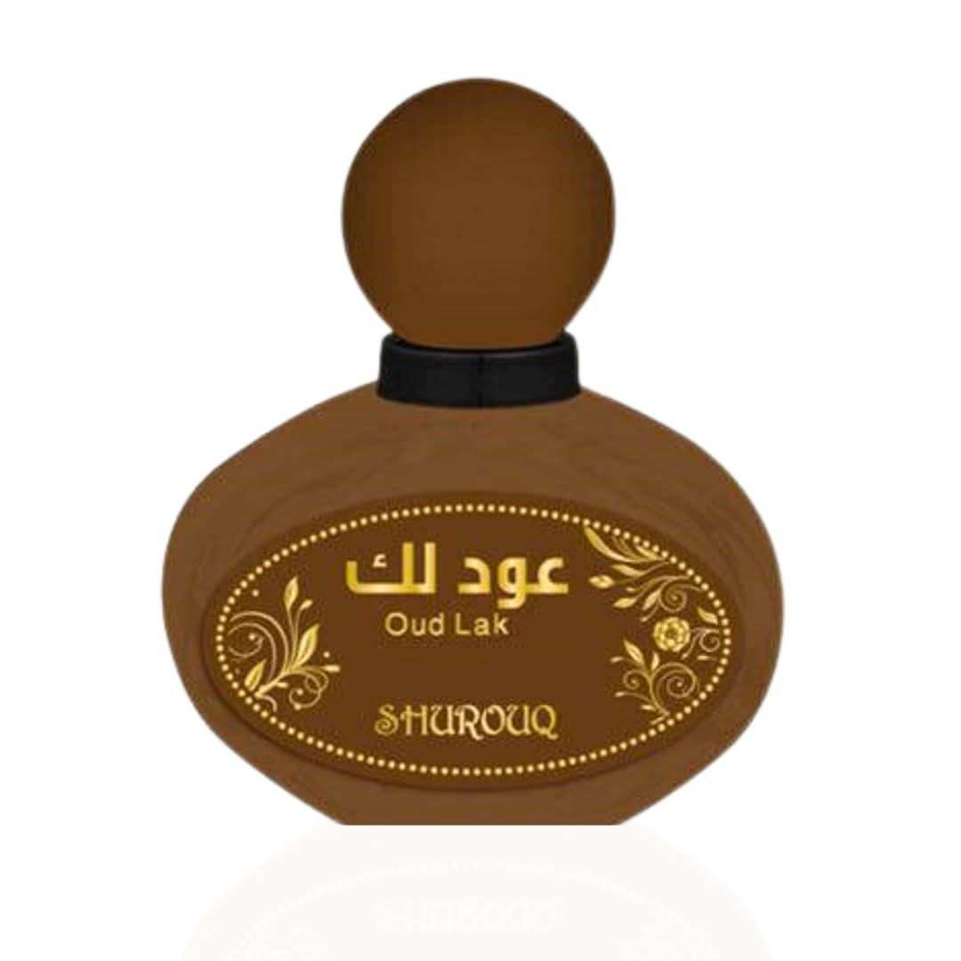 Shurouq Oud Lak EDT 100ml bottle with pouch, featuring elegant packaging and a luxurious fragrance design.