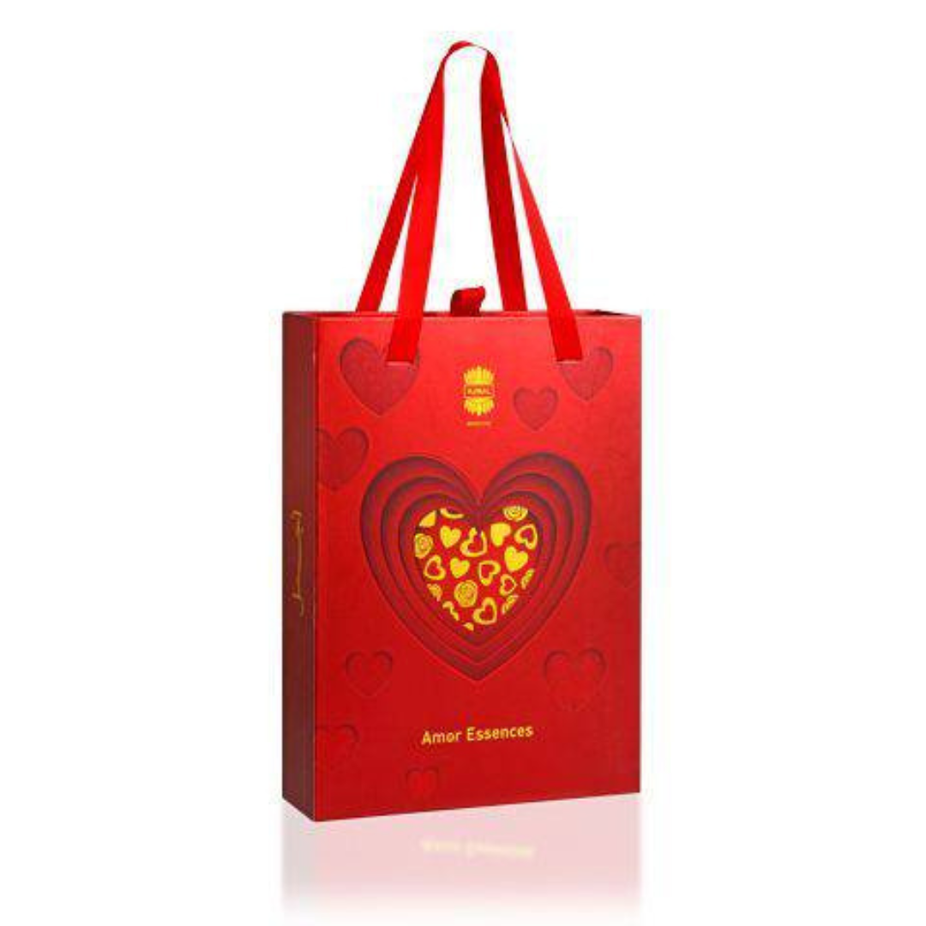 Ajmal Amor Essence for Men perfume gift set with bottles and packaging, showcasing elegant design and branding.