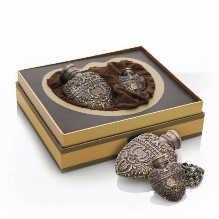 Arabian Oud Gharam Oil 25 ML Eau De Parfum bottle with elegant packaging and floral accents.