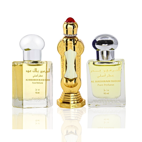 Al Haramain Sultan Perfume Oil and Black Oudh Badar concentrated perfume oils in glass bottles, showcasing elegant packaging.