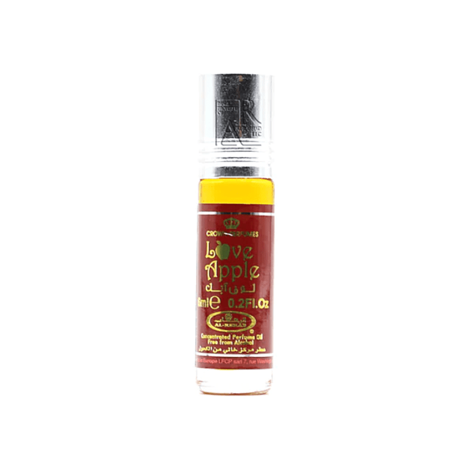 Love Apple 6ml perfume oil by Al Rehab in a clear glass bottle with a silver cap, showcasing the concentrated perfume oil.