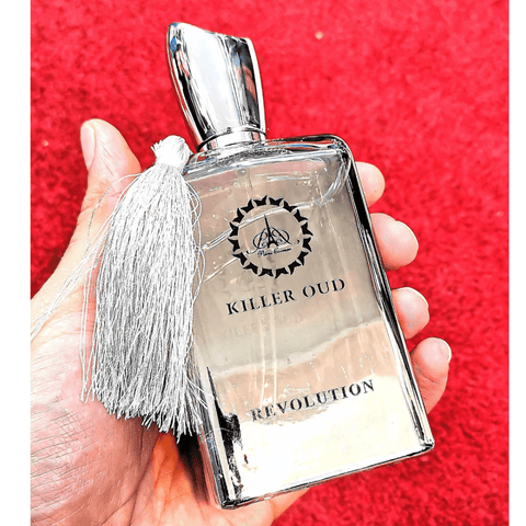 Revolution Killer Oud EDP by Killer Oud Range, 100ml bottle with dark, elegant packaging and intricate gold detailing.