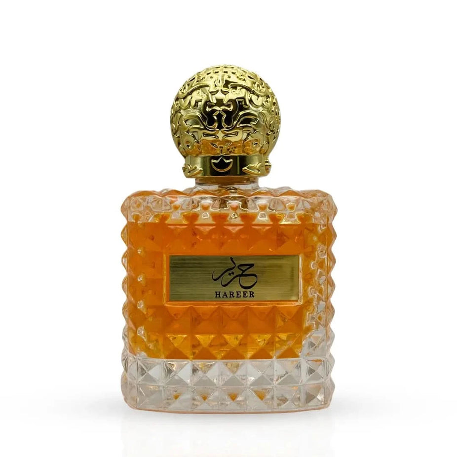 Aura by Aura Hareer Eau De Parfum Spray 100ml, elegant glass bottle with floral and woody fragrance accents.