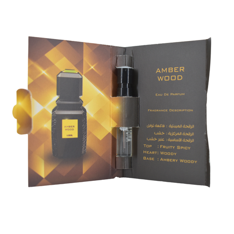 Ajmal Amber Wood Eau De Parfum sample vial, 1ml, showcasing the small glass container with amber-colored liquid.