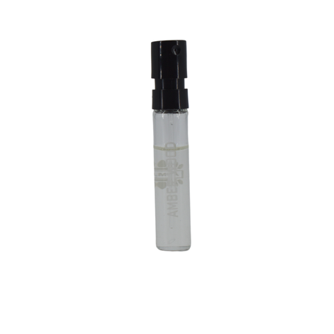 Ajmal Amber Wood Eau De Parfum 1ml sample vial, showcasing the small amber-colored glass bottle with fragrance label.