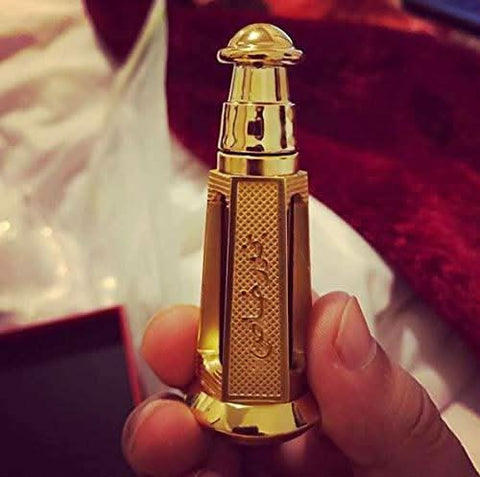 Bakhoor Khas perfume oil by Ajmal in a 3ml glass bottle with a gold cap, showcasing the luxurious fragrance packaging.