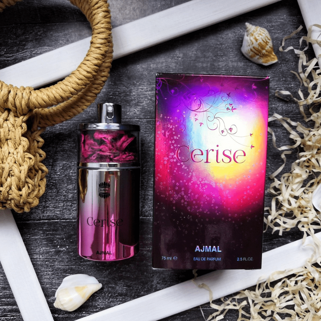 Ajmal Cerise Women EDP 75ml bottle with pink accents, showcasing the elegant perfume bottle and floral design.